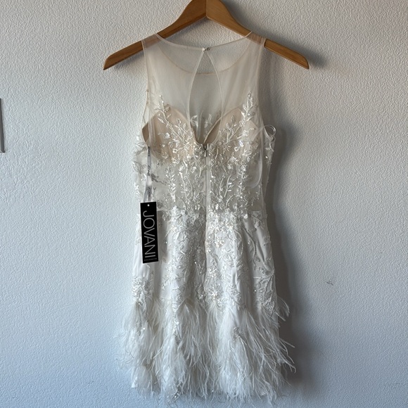 Jovani Scoop neck flower embellished bodice with mesh and a feathered Miniskirt. - Picture 9 of 10